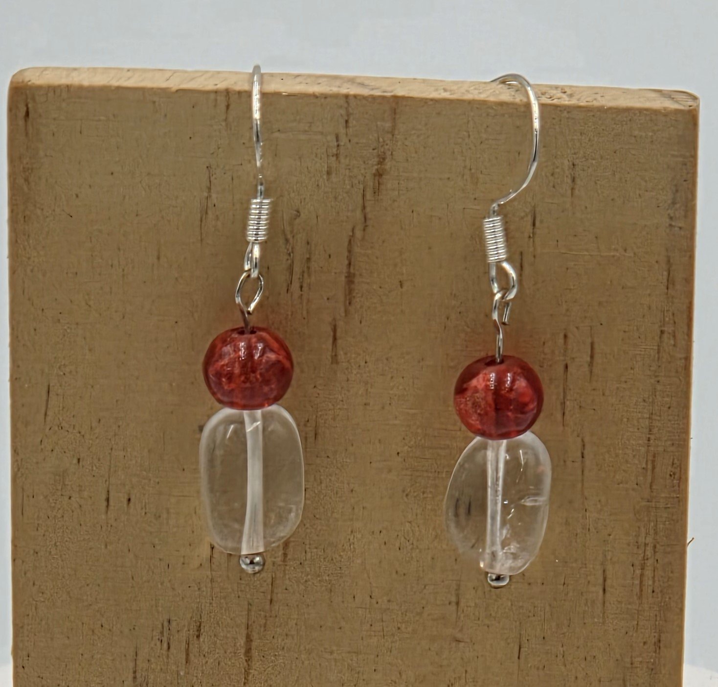 Red lampwork glass oval necklace with clear quartz nuggets, AB glass butterflies, silver flower toggle, and matching earrings.