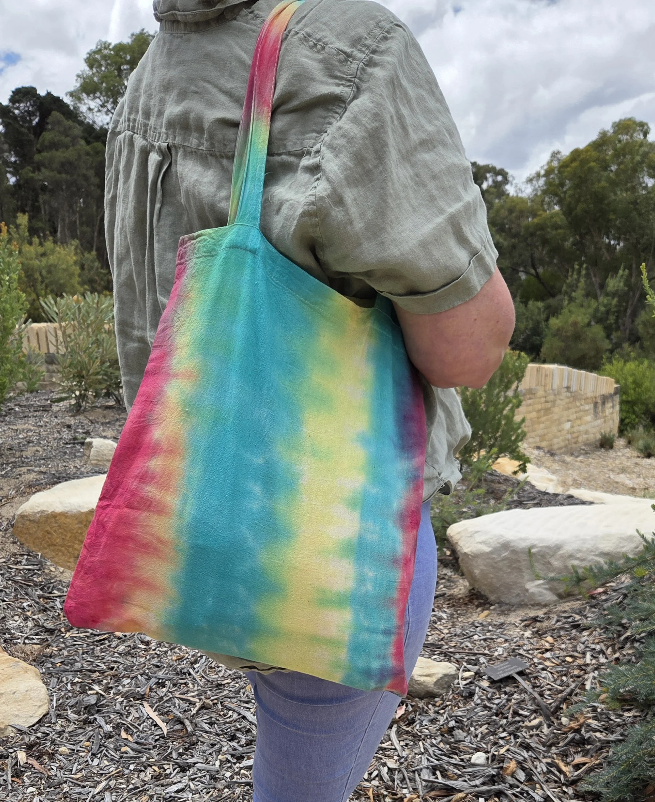 Hand-dyed 100% cotton tote bag with a high-contrast vivid botanical pattern in organic greens and earth tones. OOAK functional art by Livity Studio.