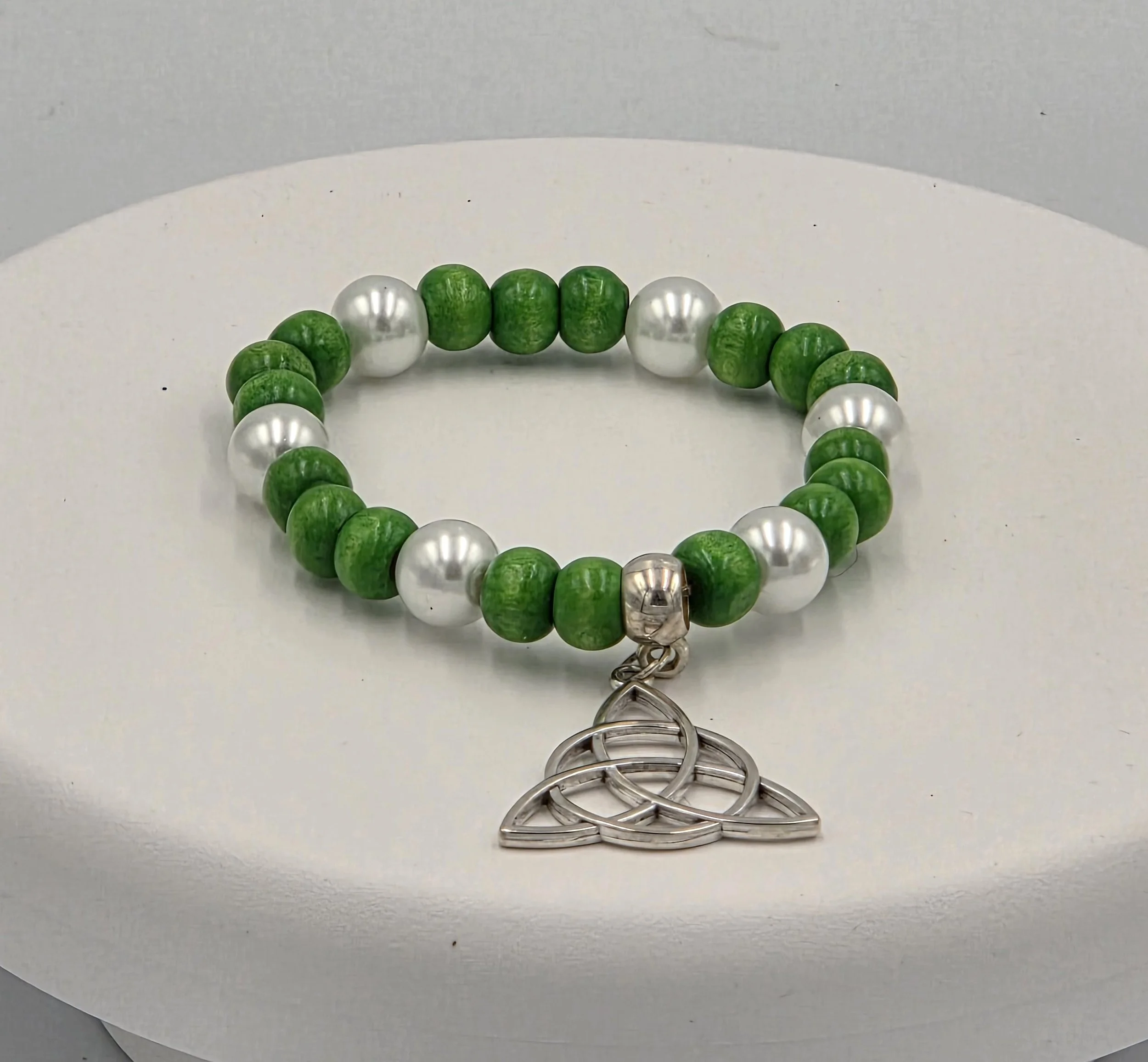 OOAK green wood and white pearl bracelet with large silver Trinity knot.