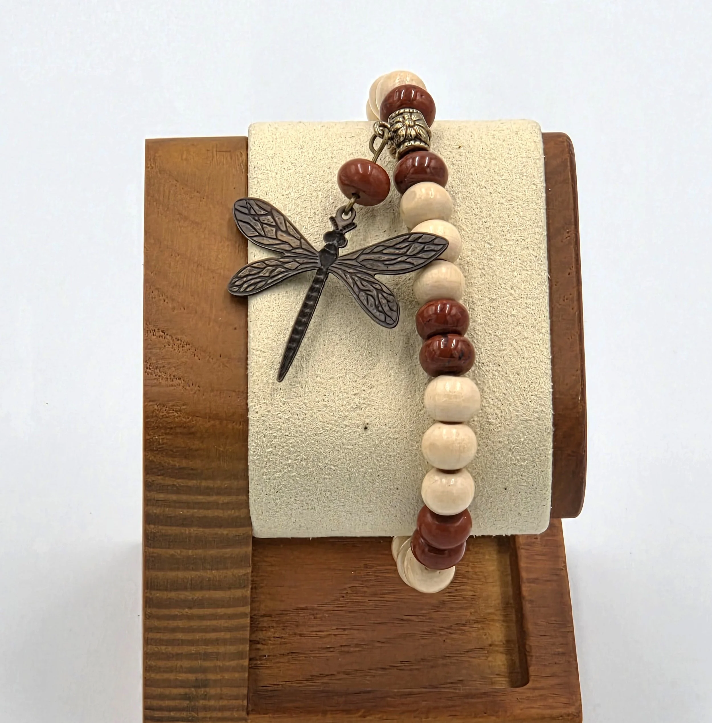 OOAK cream wood and matte red jasper bracelet with large bronze dragonfly charm.