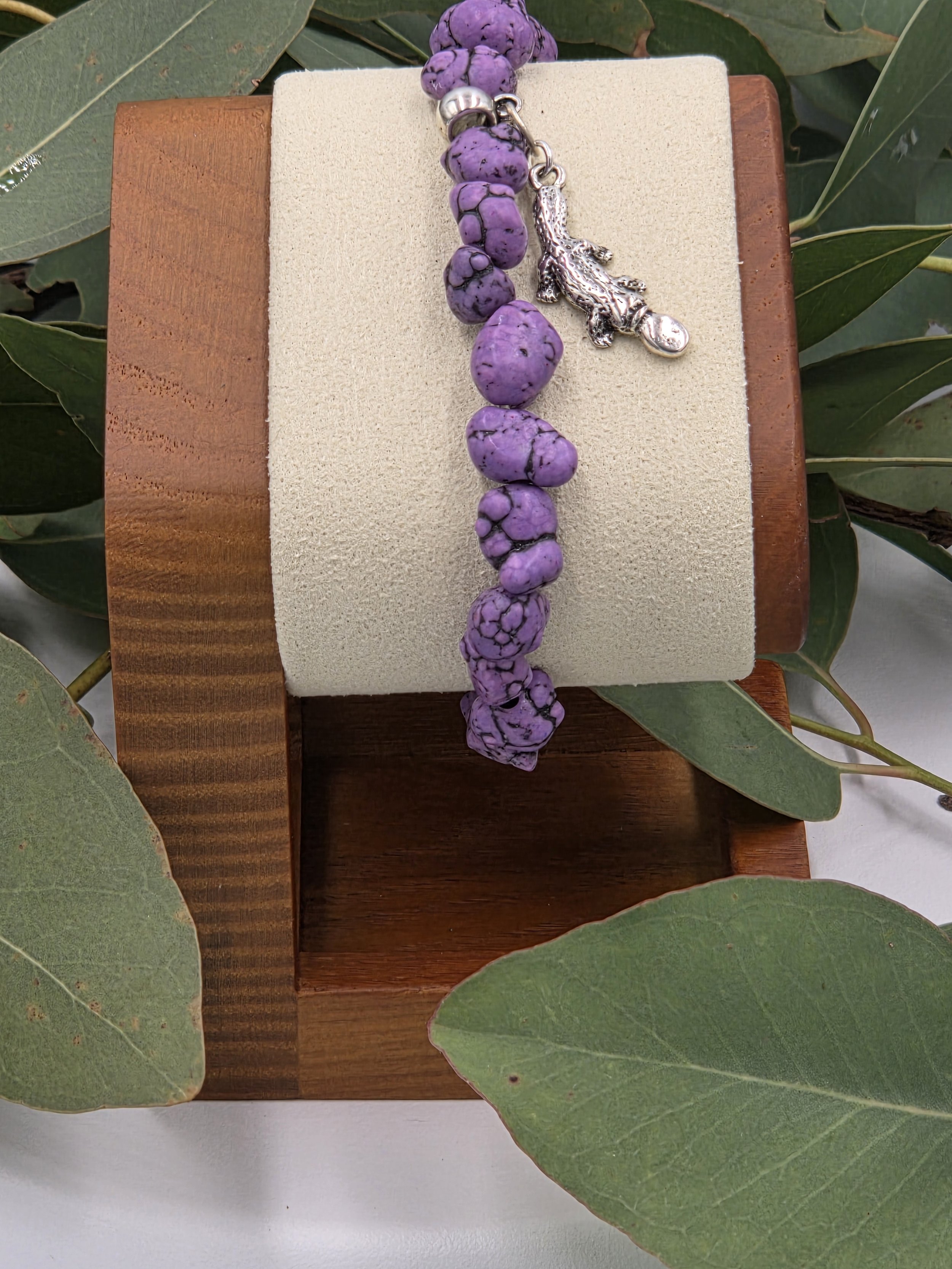 OOAK purple Howlite nugget bracelet with silver platypus charm with background of gum leaves