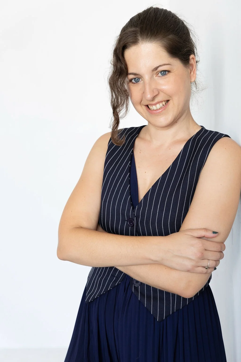 A cartoon pink and purple cockatoo with a mohawk, above the text 'PHOTO COMING SOON' in blue letters on a beige background.