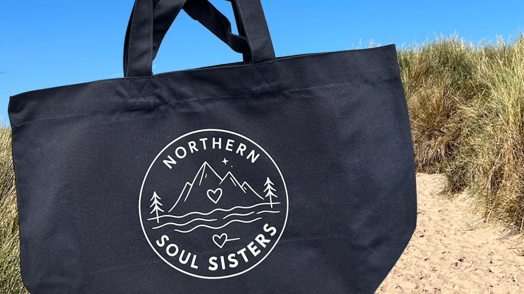 Navy organic cotton shopper-style tote bag with a DTF-printed white Northern Soul Sisters logo. Produced by Lyoness Press Studio for the local women's community group.