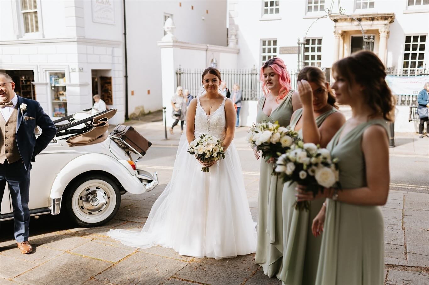 Love this photo, it&rsquo;s a real &ldquo;insta vs reality&rdquo; moment - to my left, my gorgeous bride Sarra arriving at the church, to my right, a group of people who didn&rsquo;t quite make the guest list for the daytime but wanted to see her any