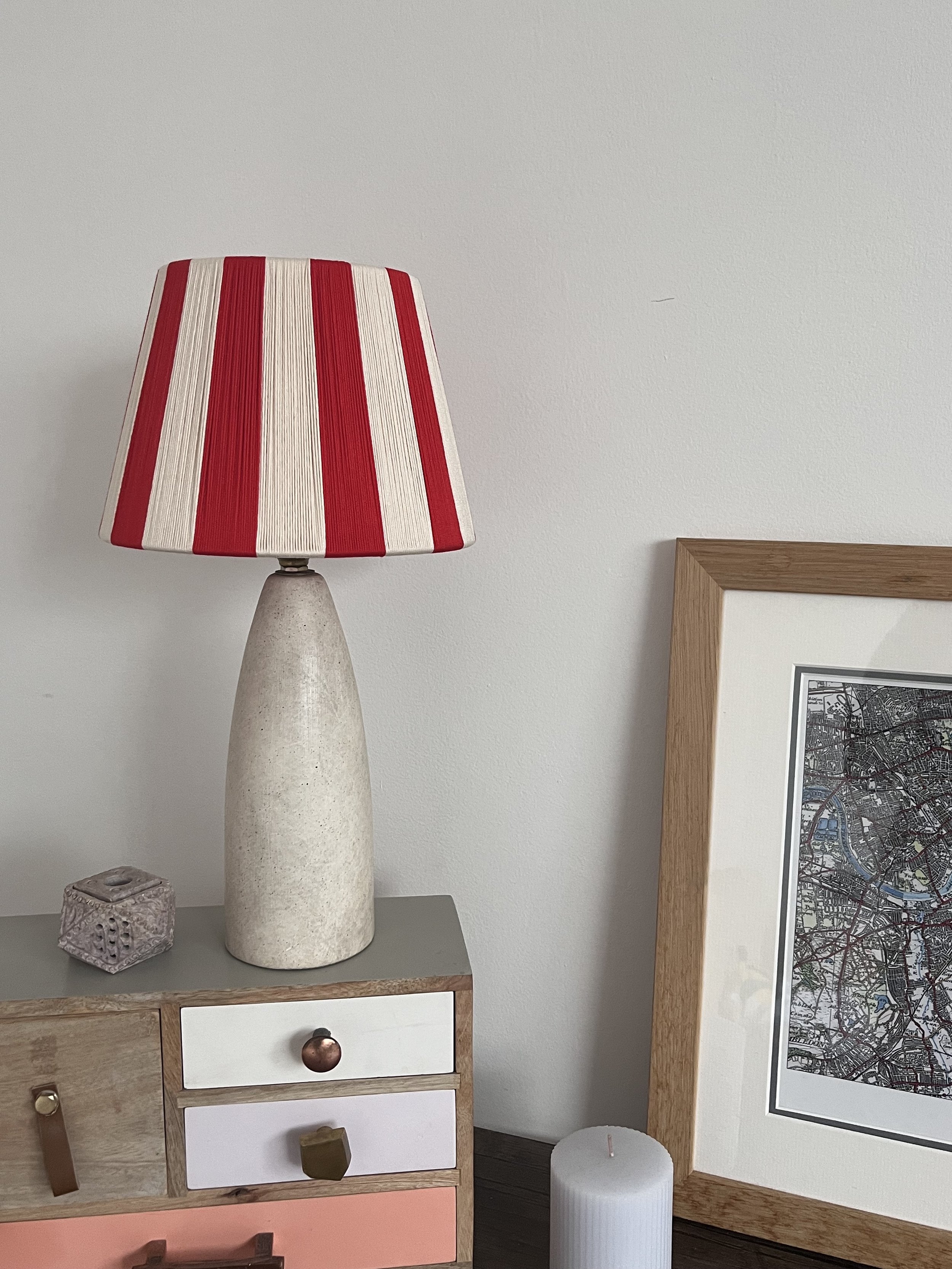 The Candy Cane Circus string lampshade shown on a small table lamp