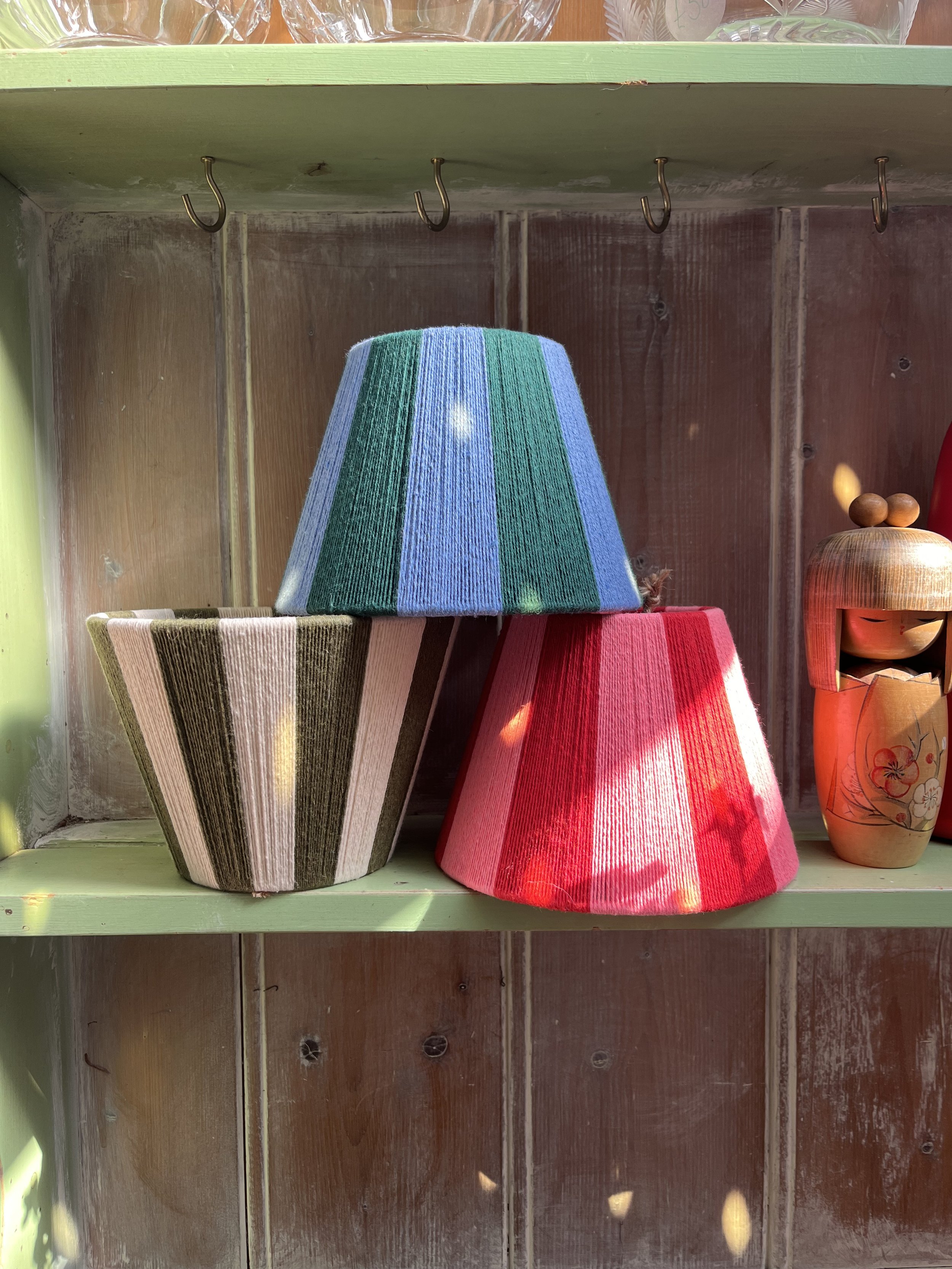 the twilight lampshade stacked with other candle clip lampshades of different colours.