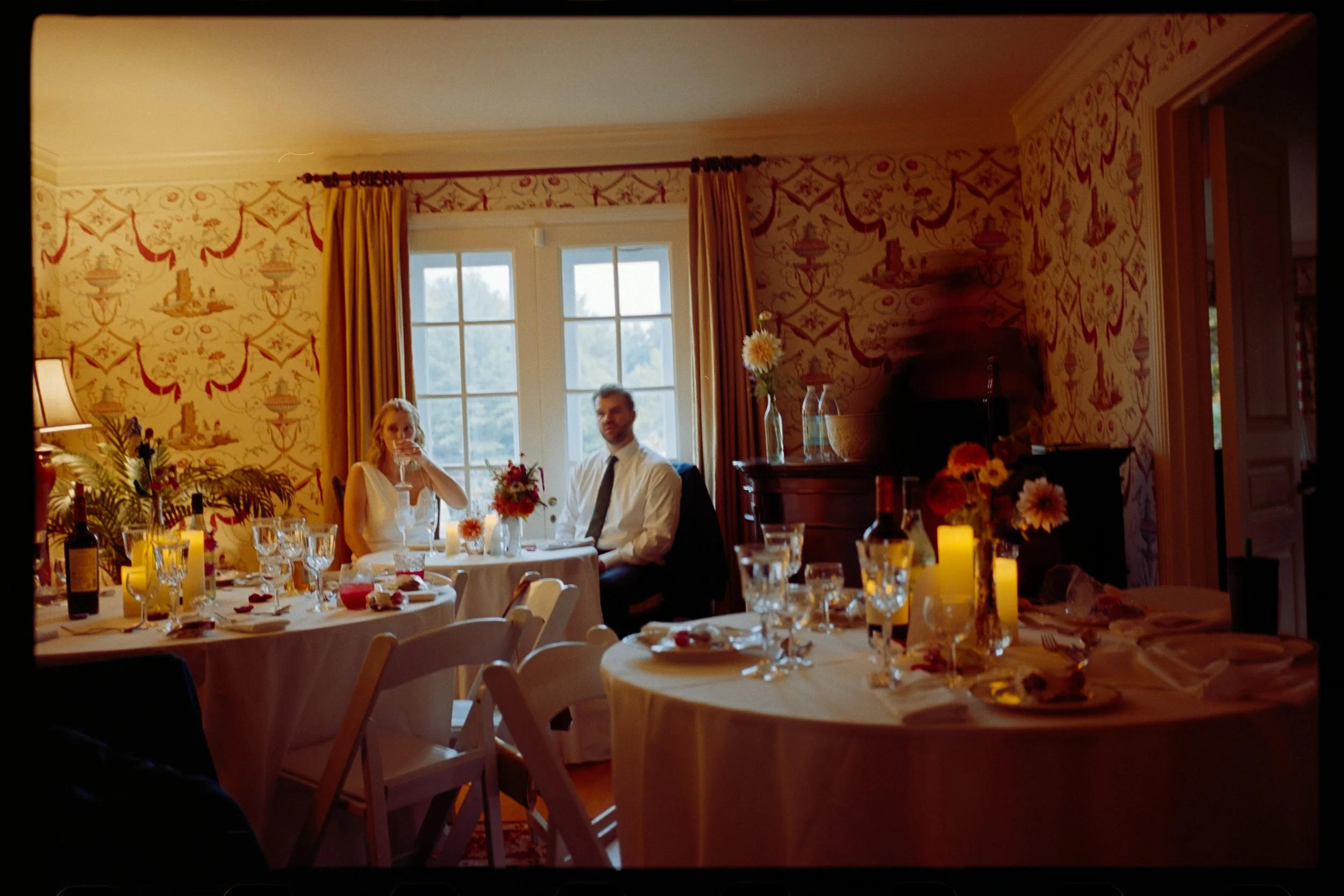 An analog film photo of a wedding reception dinner taken by a Puerto Rico Based Wedding and Elopement Film Photographer
