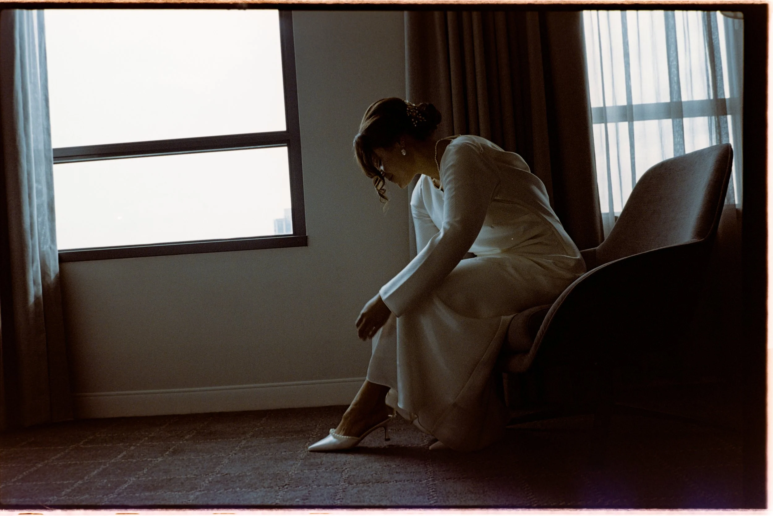 Candid bridal preparations by San Juan photographer captured with a documentary film style