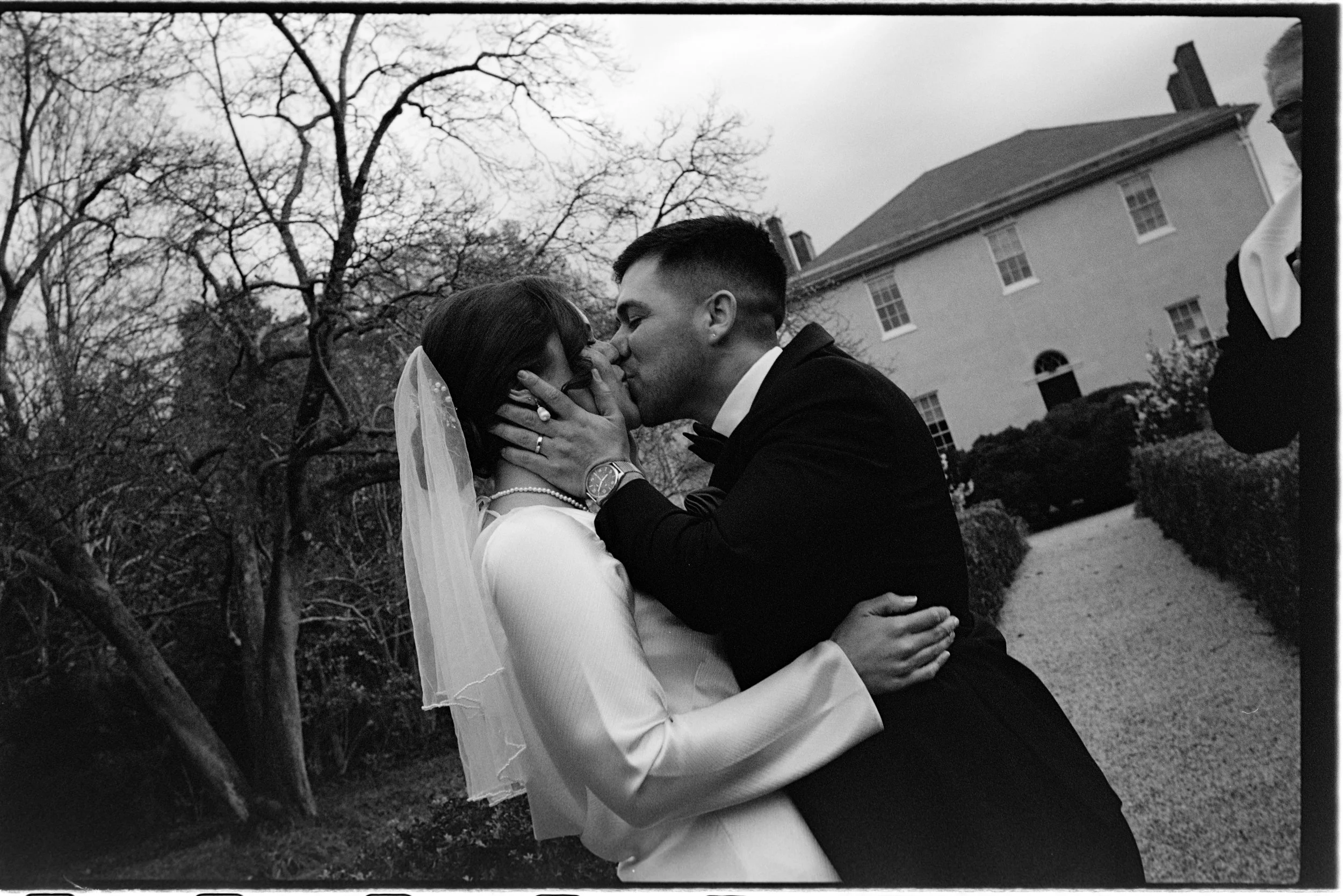 A vintage-inspired wedding photo showcasing the analog textures of 35mm format film.