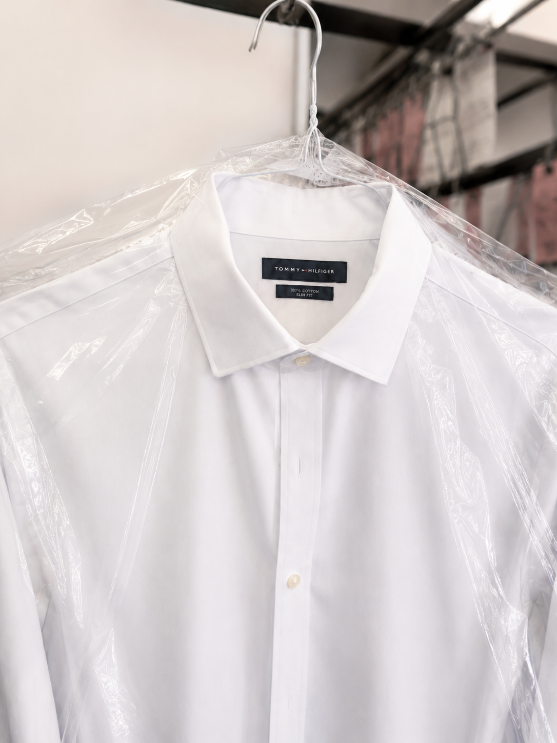 Clean pressed white dress shirt ready for pickup.