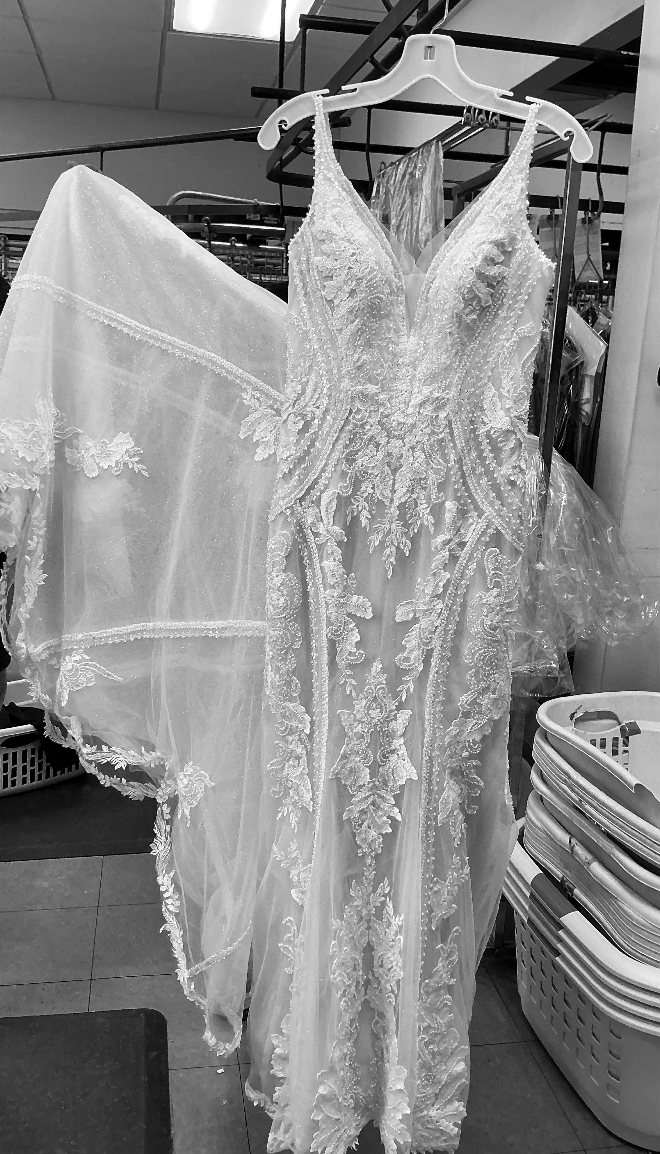 Detailed lace bridal gown after professional wedding dress cleaning at Joy Cleaners in Milwaukee