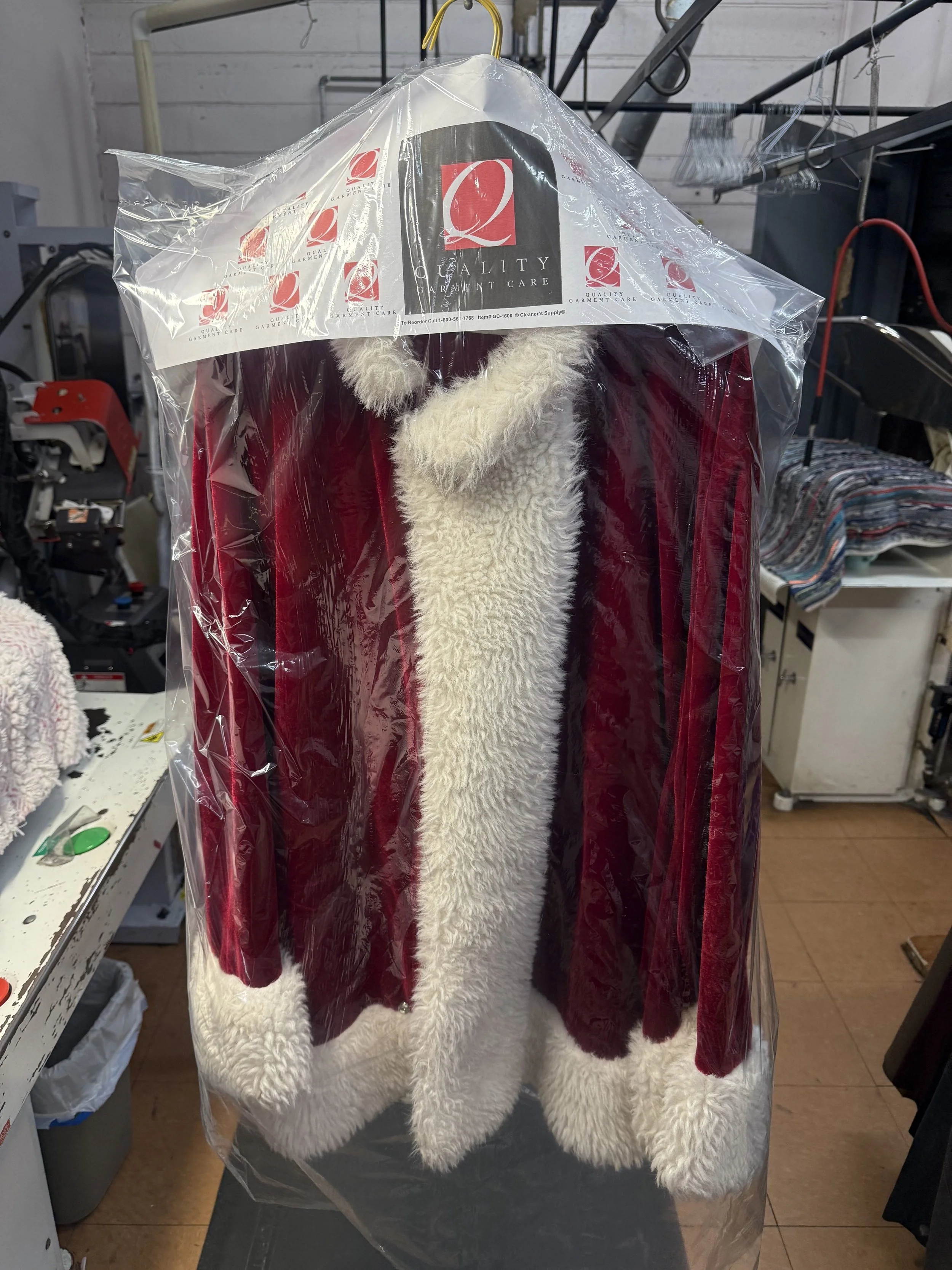 Luxury specialty garment receiving professional dry cleaning and delicate garment care service.