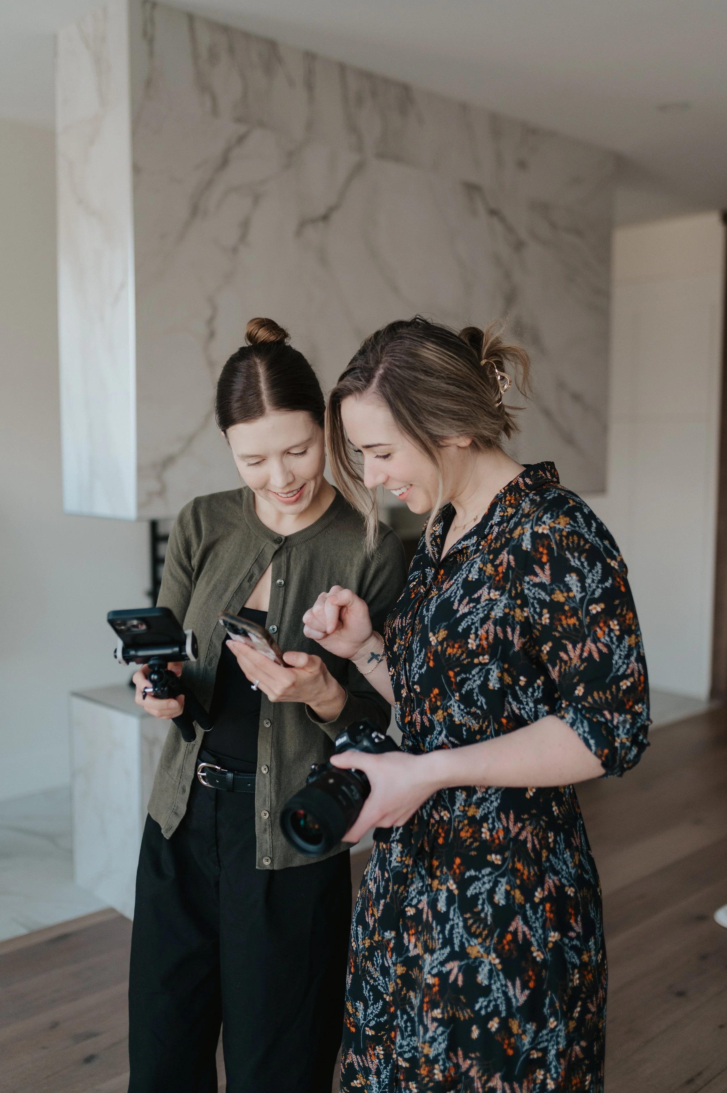Photograph of photographer and content creator working together on bts creation for client