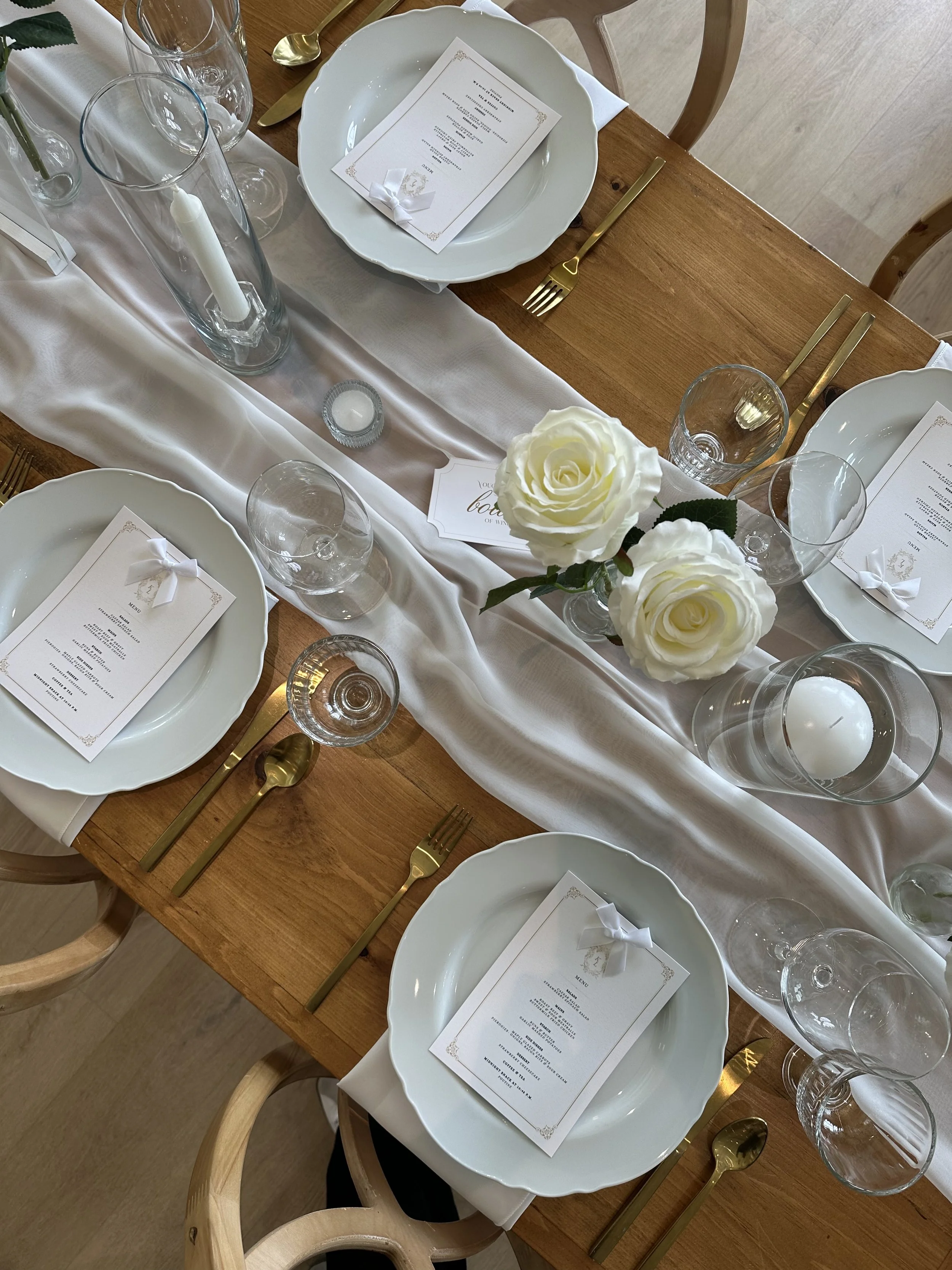 Elegant and timeless wedding tablescape photographed in natural light, showcasing Wildflower Events’ candid and creative storytelling approach.