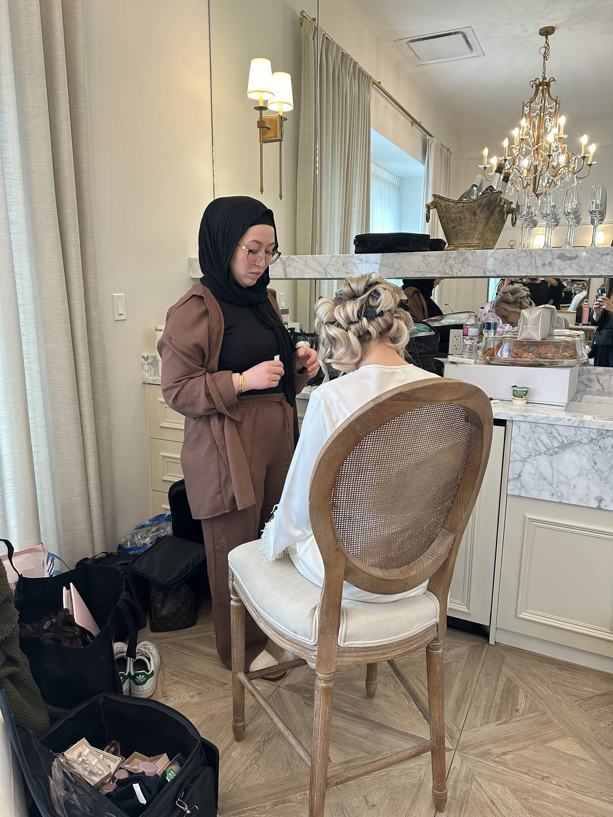 Candid, heartfelt moments of the bride preparing in the bridal suite, captured through authentic Edmonton wedding content creation.