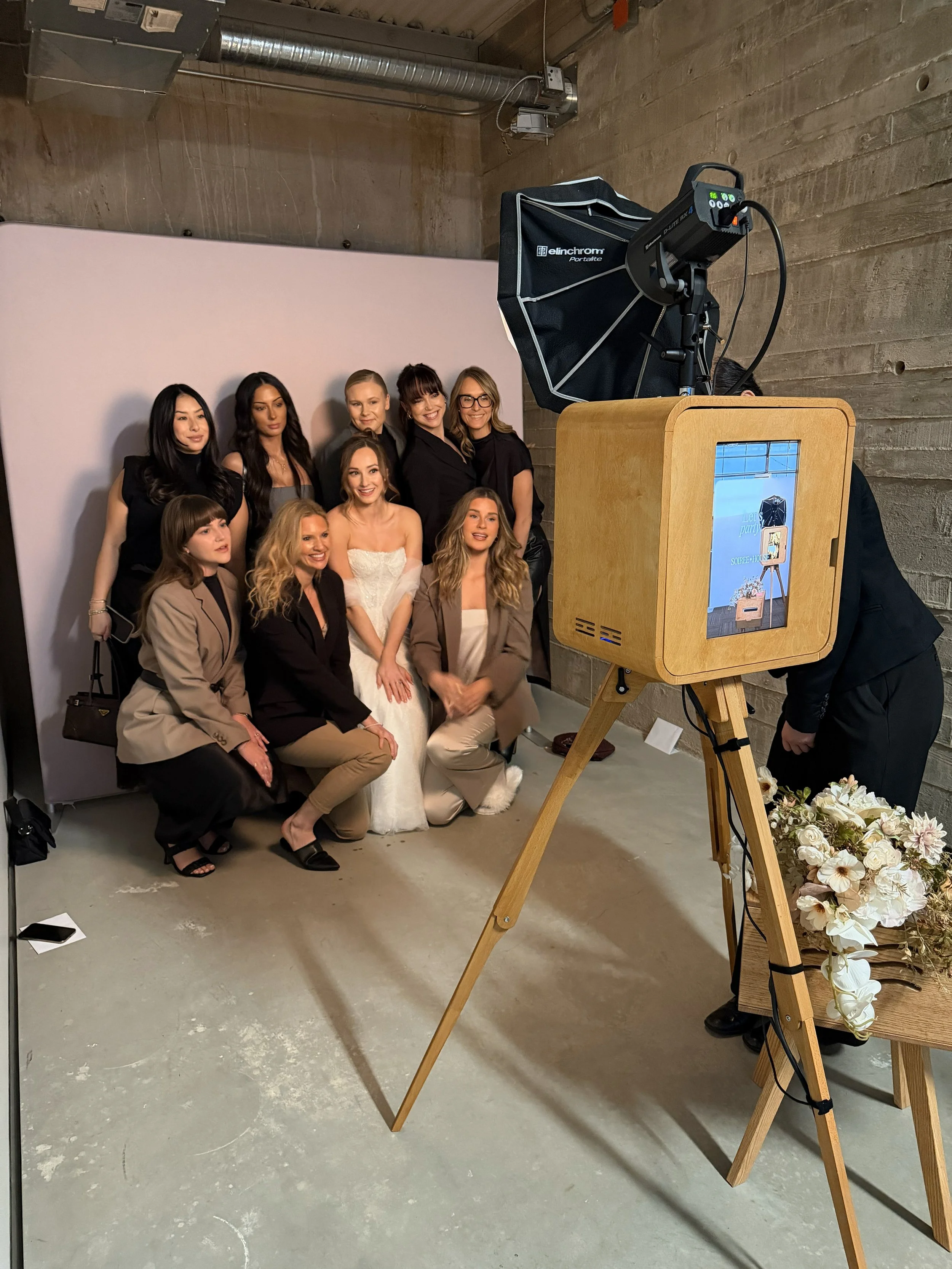 Photograph taken of bride taking a photobooth picture by Wildflower Events Content Creation YEG