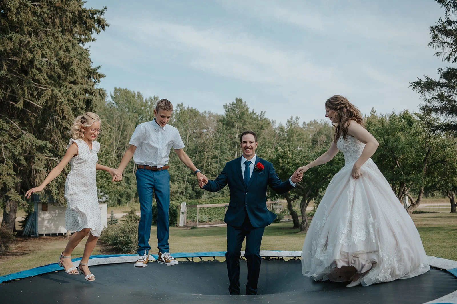 Behind-the-scenes photograph captured of the bride and groom having fun on their wedding day