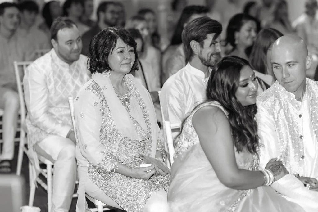 Photograph of mother of groom being present during wedding ceremony