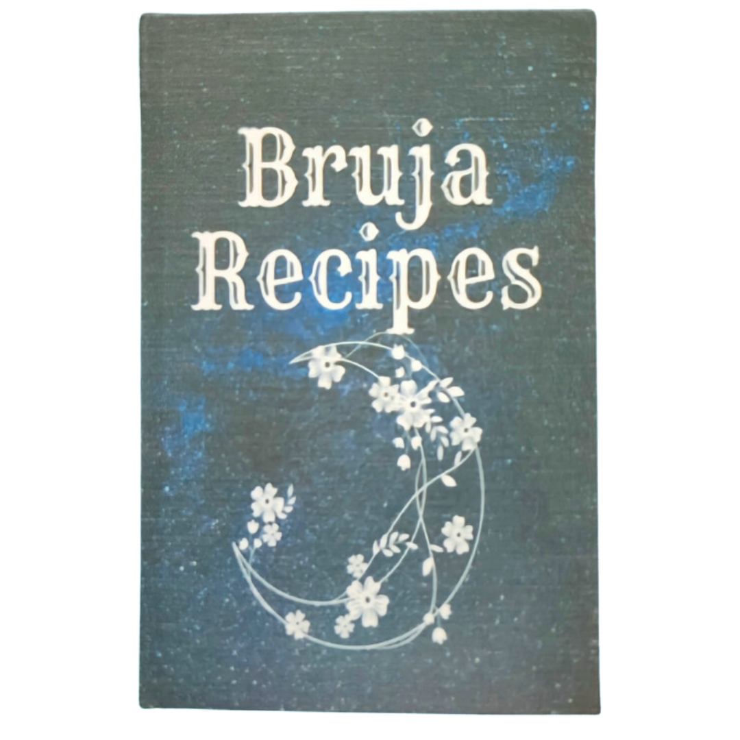 A dark book cover titled 'Bruja Recipes' with white stylized text and a decorative floral design in white.