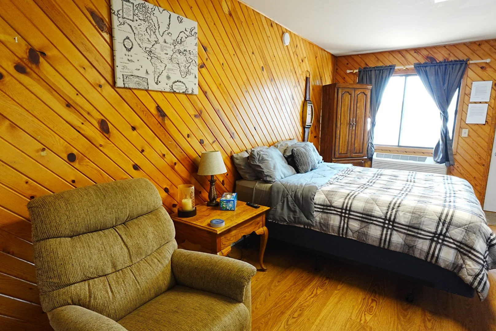 Queen Bed Studio Style Room with Comfortable Recliner