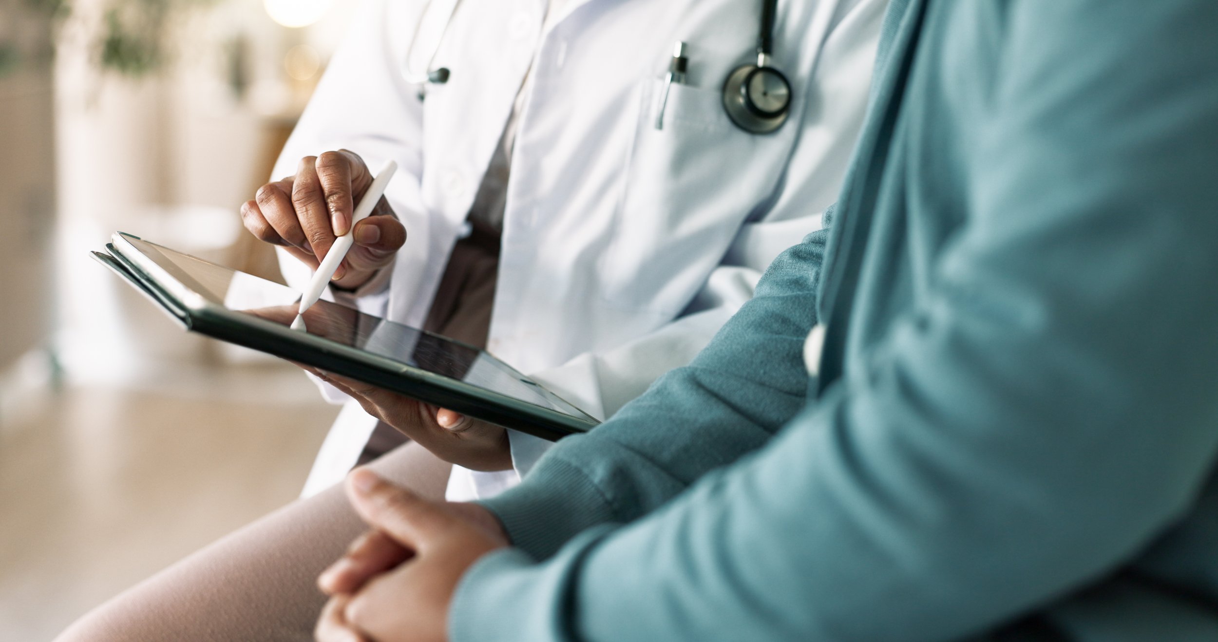 Healthcare provider reviewing lung cancer screening eligibility criteria with a patient.