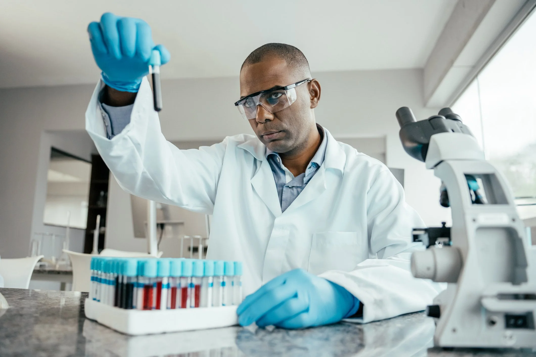 Blood sample being prepared in a clinical laboratory for biomarker testing.