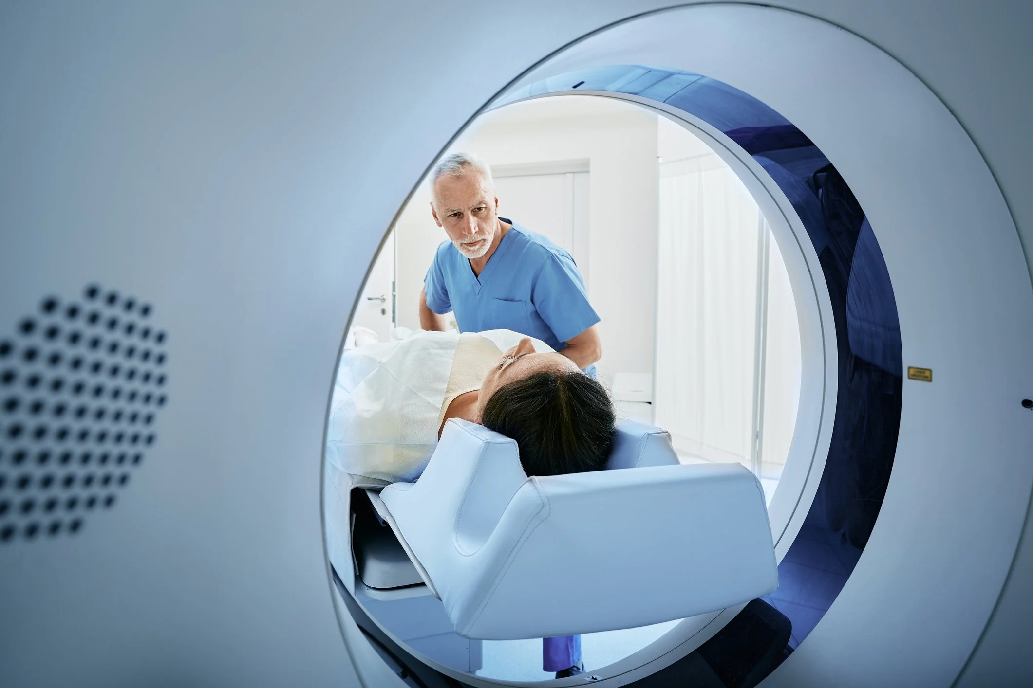 Patient preparing for a low-dose CT scan used in lung cancer screening and early detection.