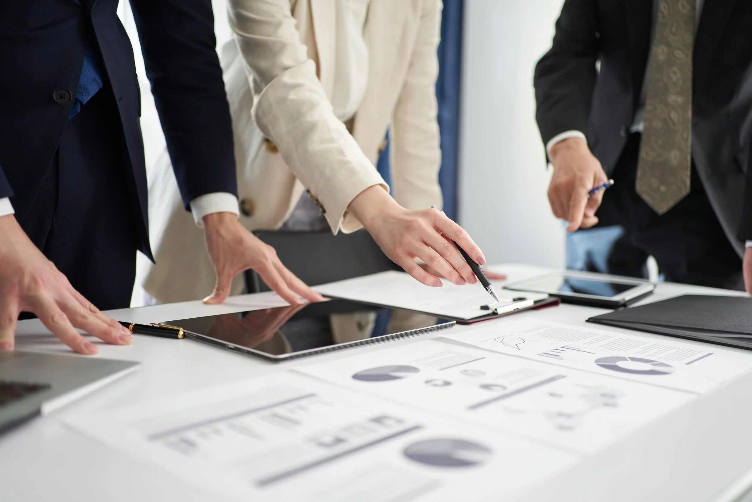 Business professionals reviewing company milestones and progress reports in lung cancer diagnostics, highlighting key achievements in medical innovation.