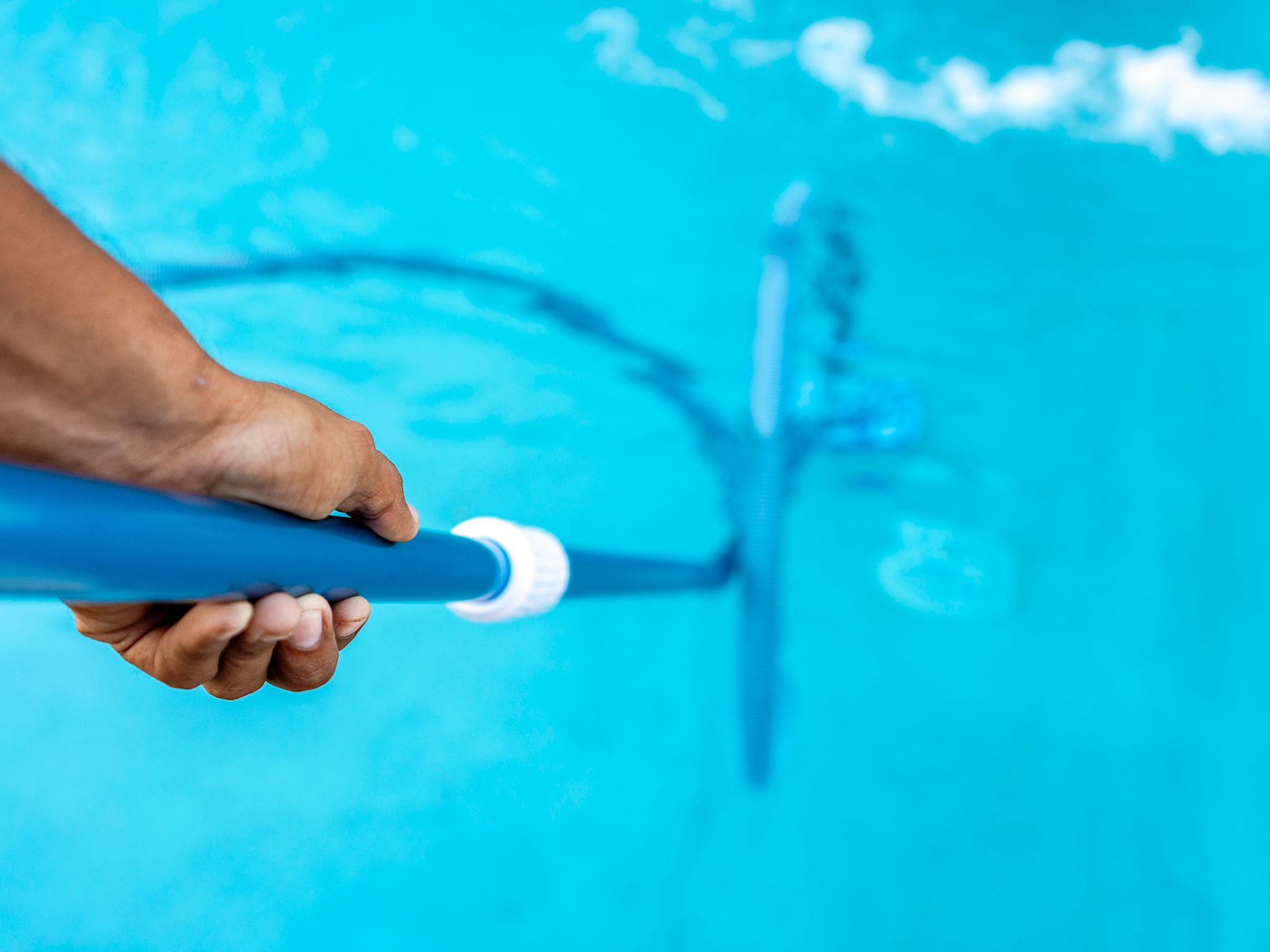 pool vacuum in an in-ground pool | Swimming Pools of Tupelo - Your Trusted Pool Experts in MS
