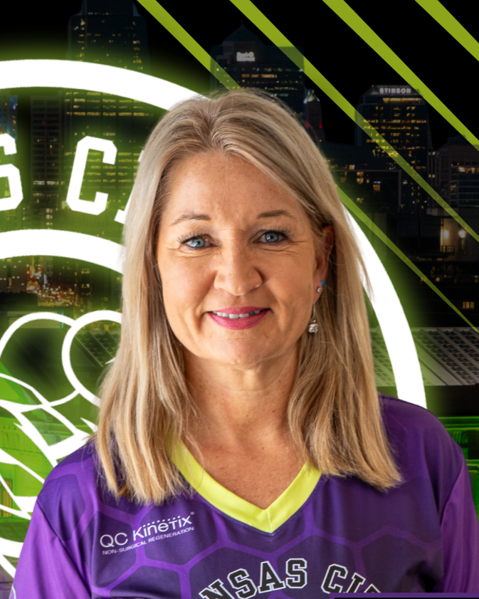 A woman playing pickleball indoors, wearing a visor and glasses, holding a paddle, with "NPL" and "JOOLA" logos visible.