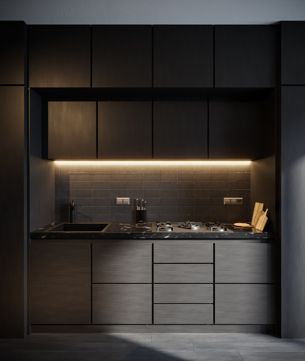 Modern kitchen with black cabinetry, grey backsplash tiles, black countertop, gas stove, sink, and under-cabinet lighting.