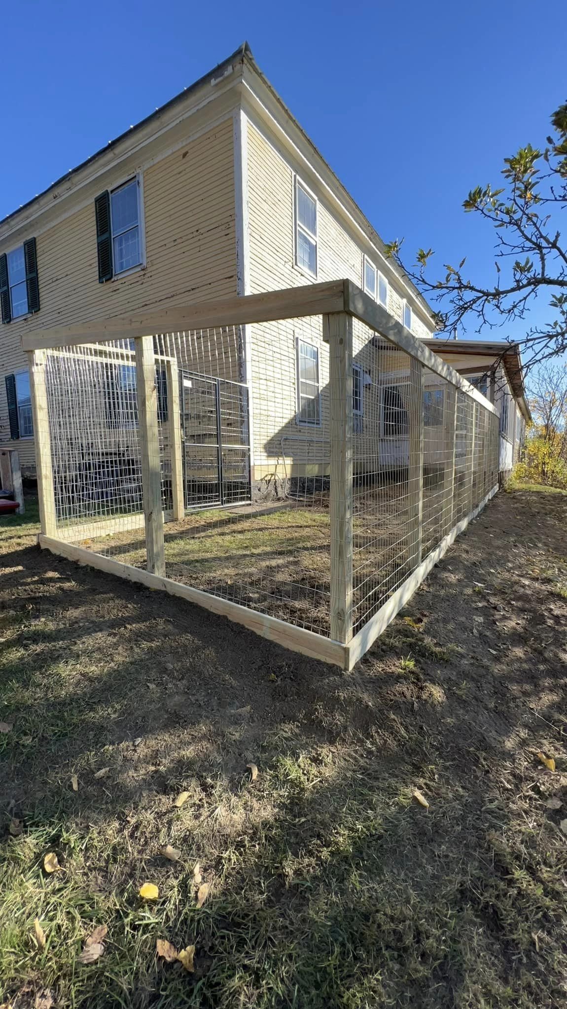 6' high board on post wire fence with no trim or top , heavy duty gate installed from local hardware store