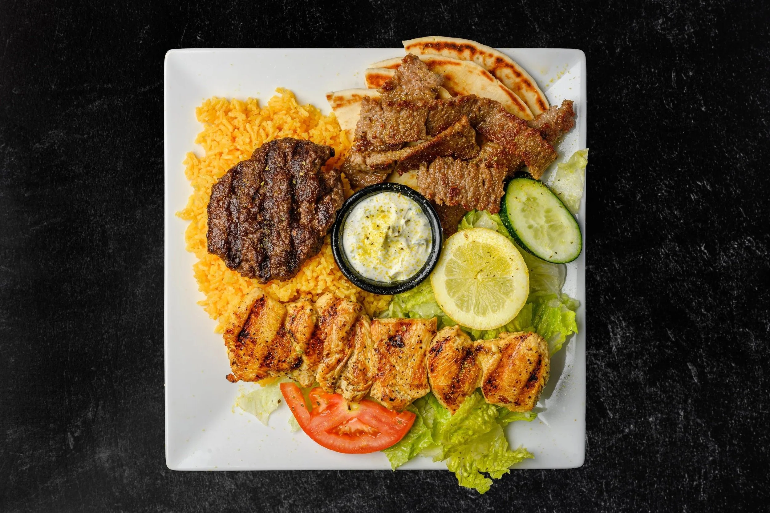 || #8 COMBINATION PLATE || Chicken Souvlaki Stick + Greek Kabob (beef) + Gyro Meat + Side of Rice + Pita Bread + Side of Salad W/ House Made Greek Dressing + Comes with Tzatziki Sauce 