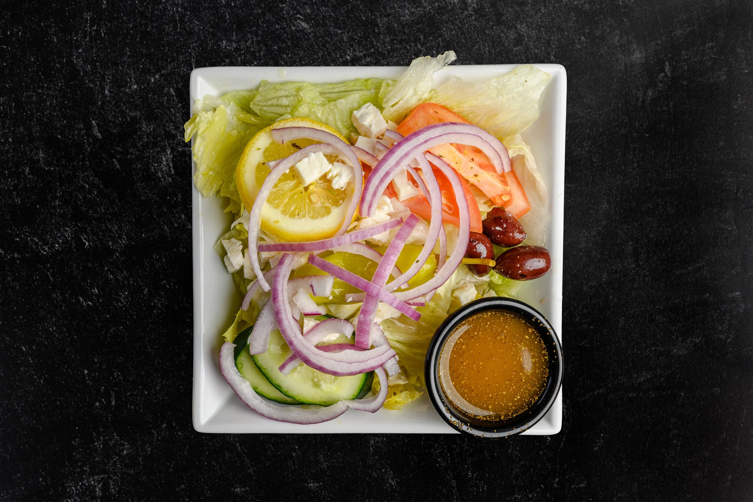 || #12 SMALL GREEK SALAD || Iceberg Lettuce + Tomato + Cucumber + Lemon + Unpitted Greek Olives + Pepperoncini + Feta Cheese + Red Onion + W/ House Made Greek Dressing 
