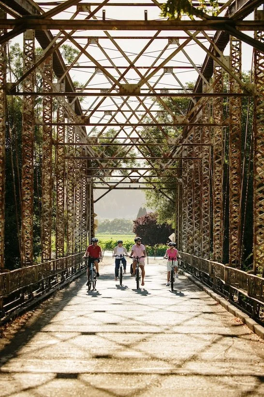 Bicycle group on a tour with Bike Tour Sonoma crossing Lambert Bridge