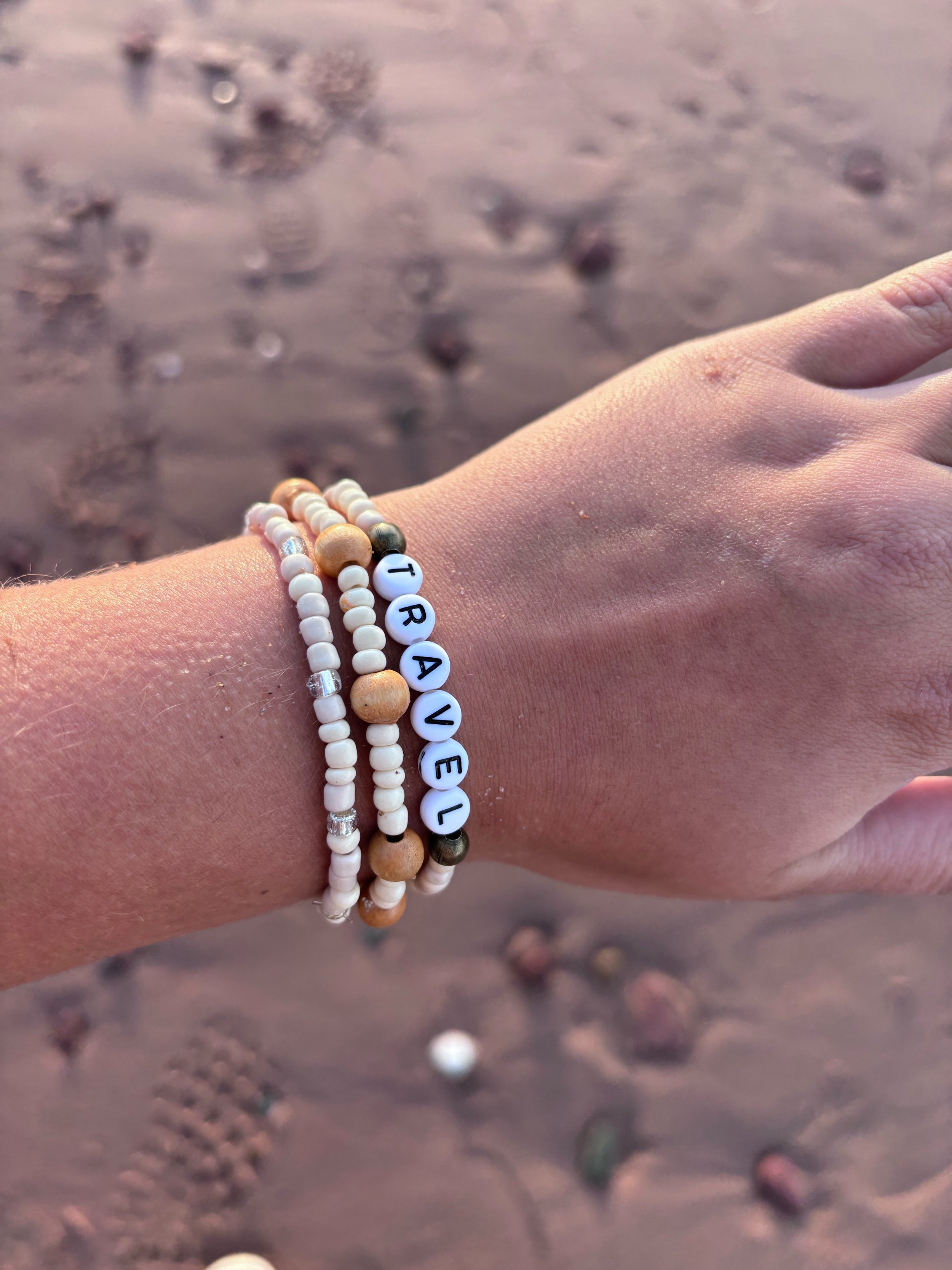 travel hand sand.jpeg