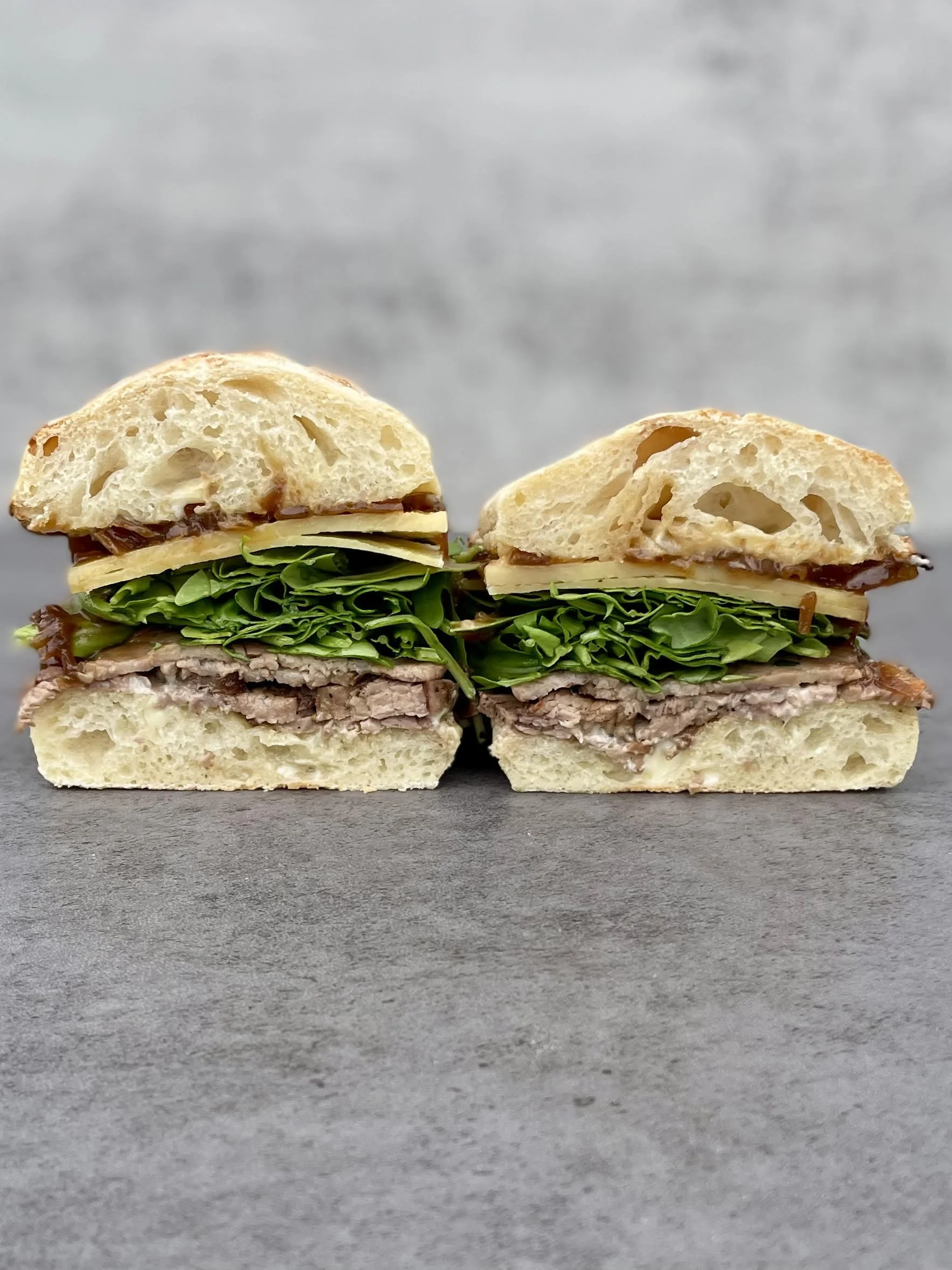 roasted tri tip, irish cheddar, house mayo, housemade worcestershire shallot jam, arugula, toasted one loaf bakery sourdough ciabatta