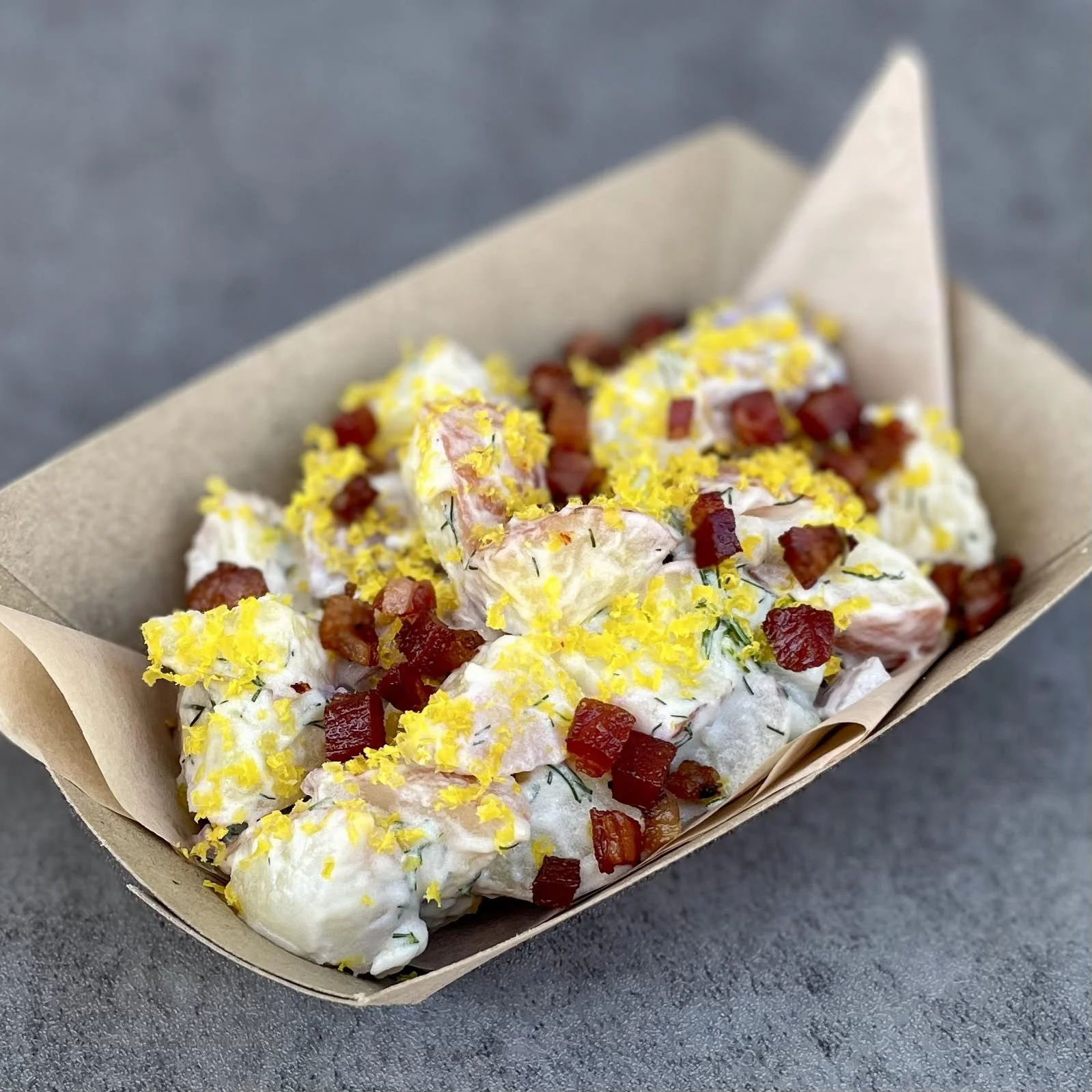 potato salad
potatoes, pickled dill cucumbers, house mayo, house cured and smoked bacon bits, cured farmers market eggyolk