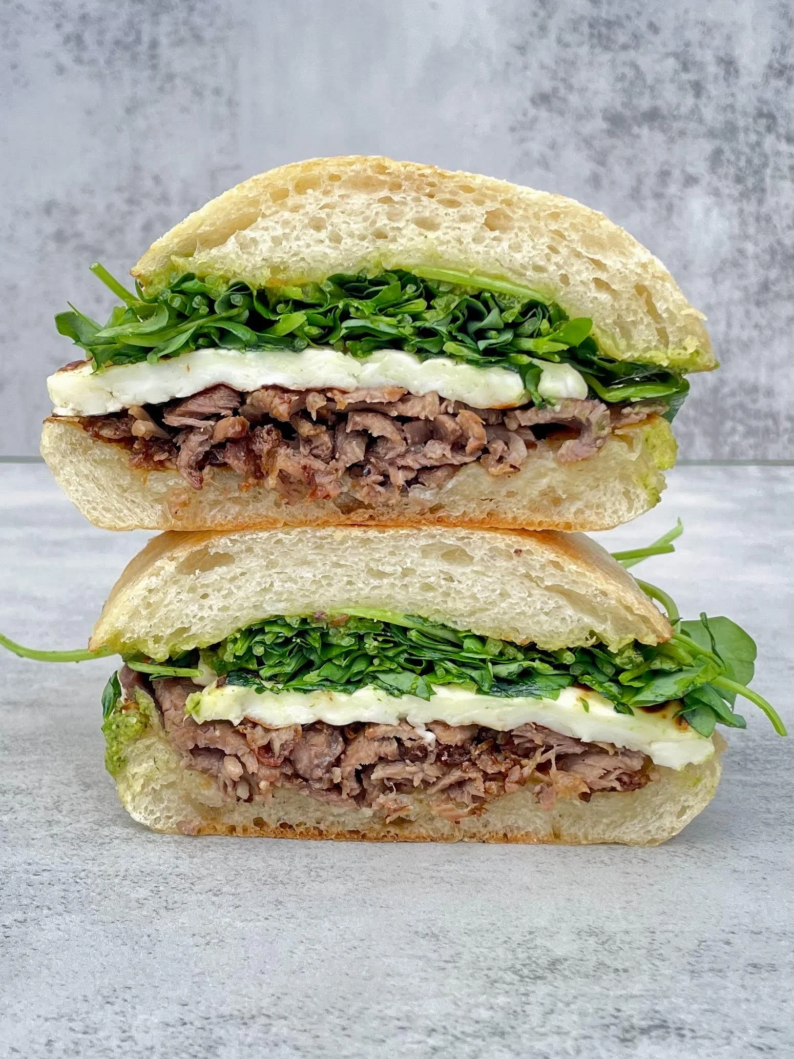 roasted leg of lamb, griddled halloumi, local pea shoots, mint sauce, butter local ciabatta