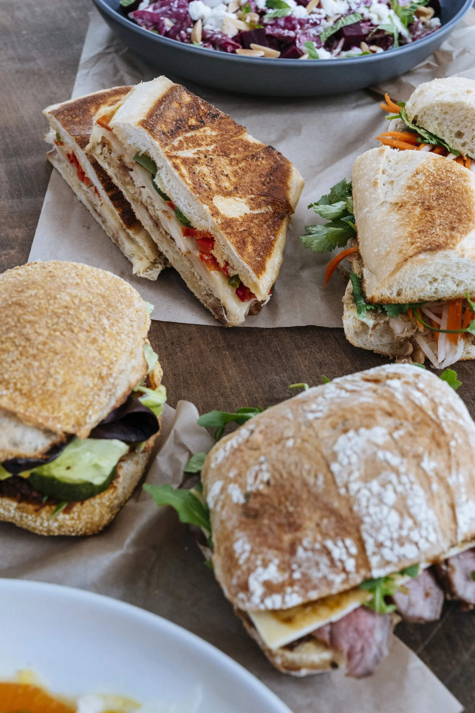 unique sandwich ideas from many different cultures on a table at wich doctor sandwiches food truck