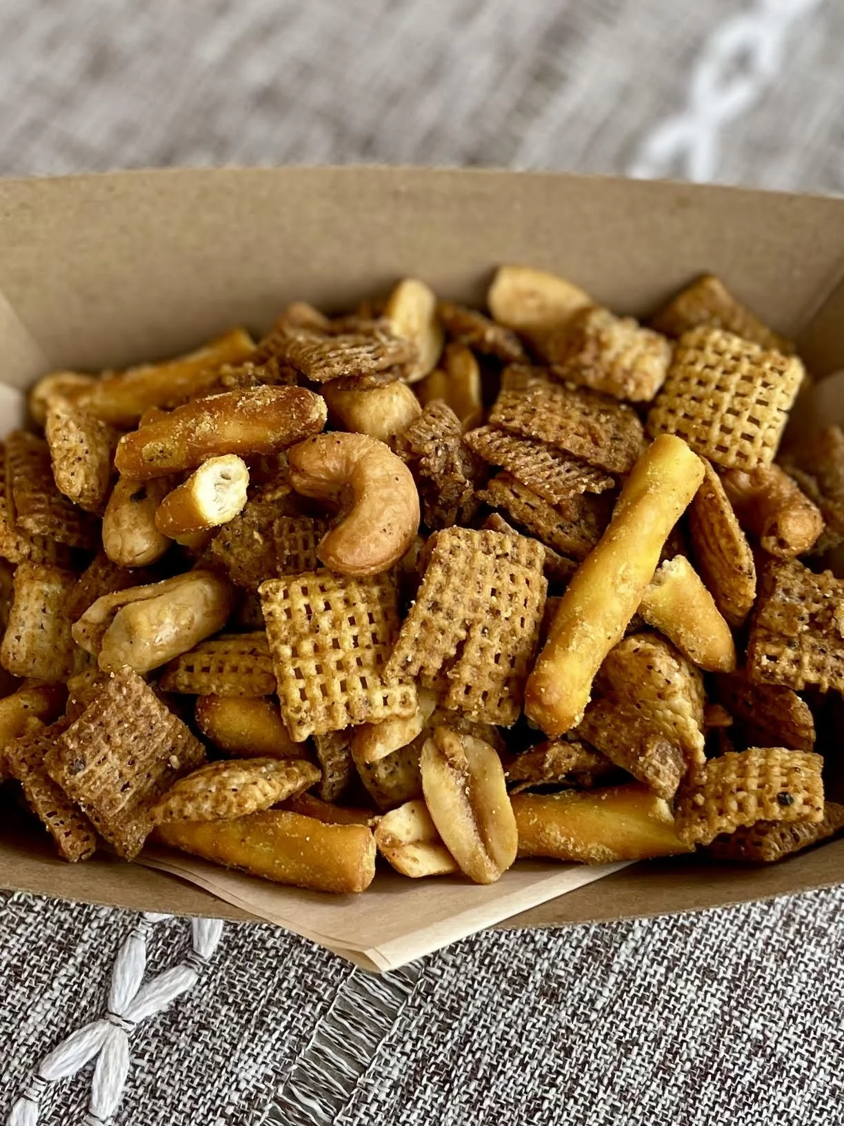 house smoked chex mix, honey mustard pretzels, cashews, peanuts, black pepper, butter