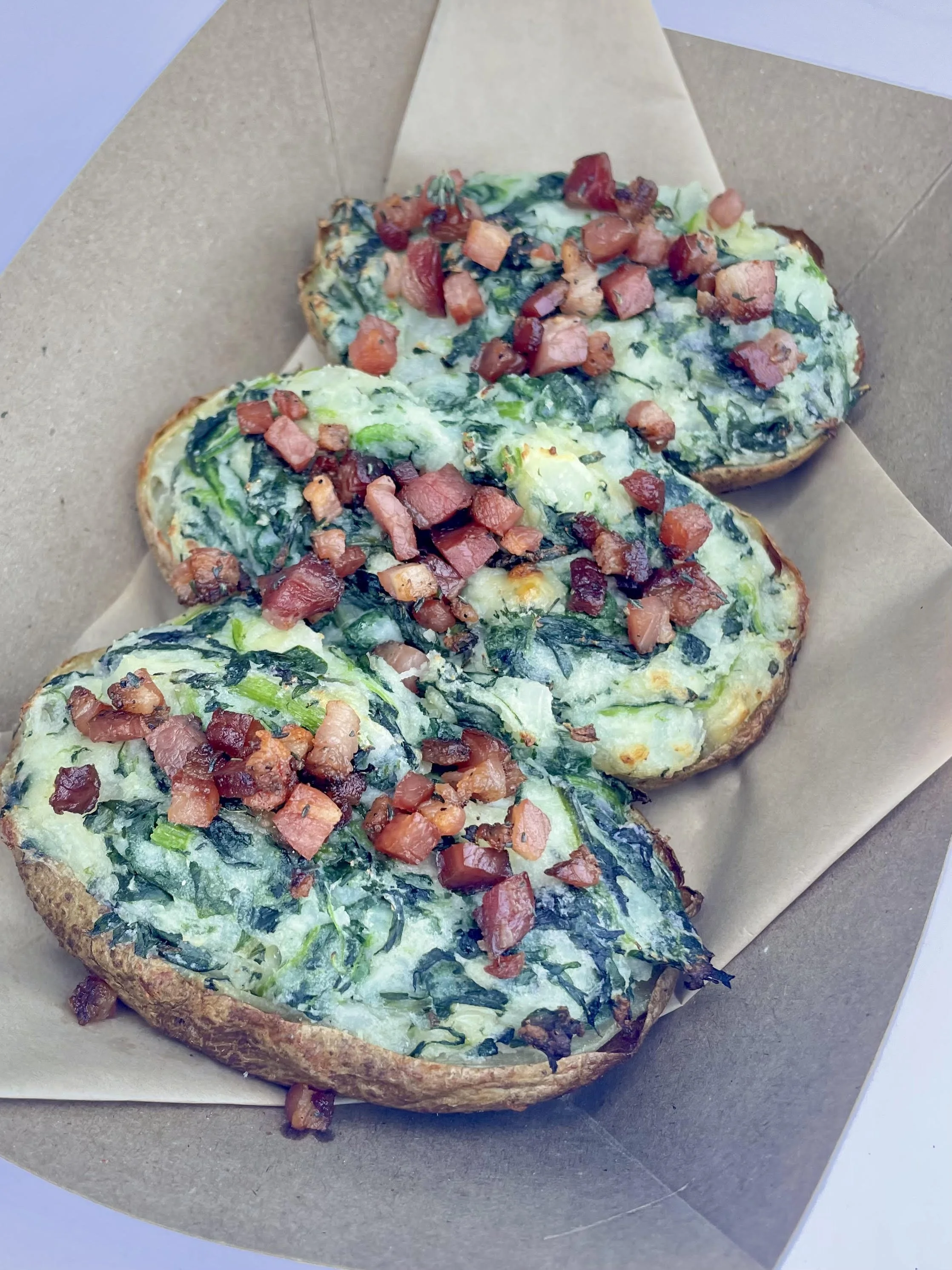 twice baked colcannon potato
mashed potato, spinach, kale, sour cream, irish cheddar, housemade bacon bits