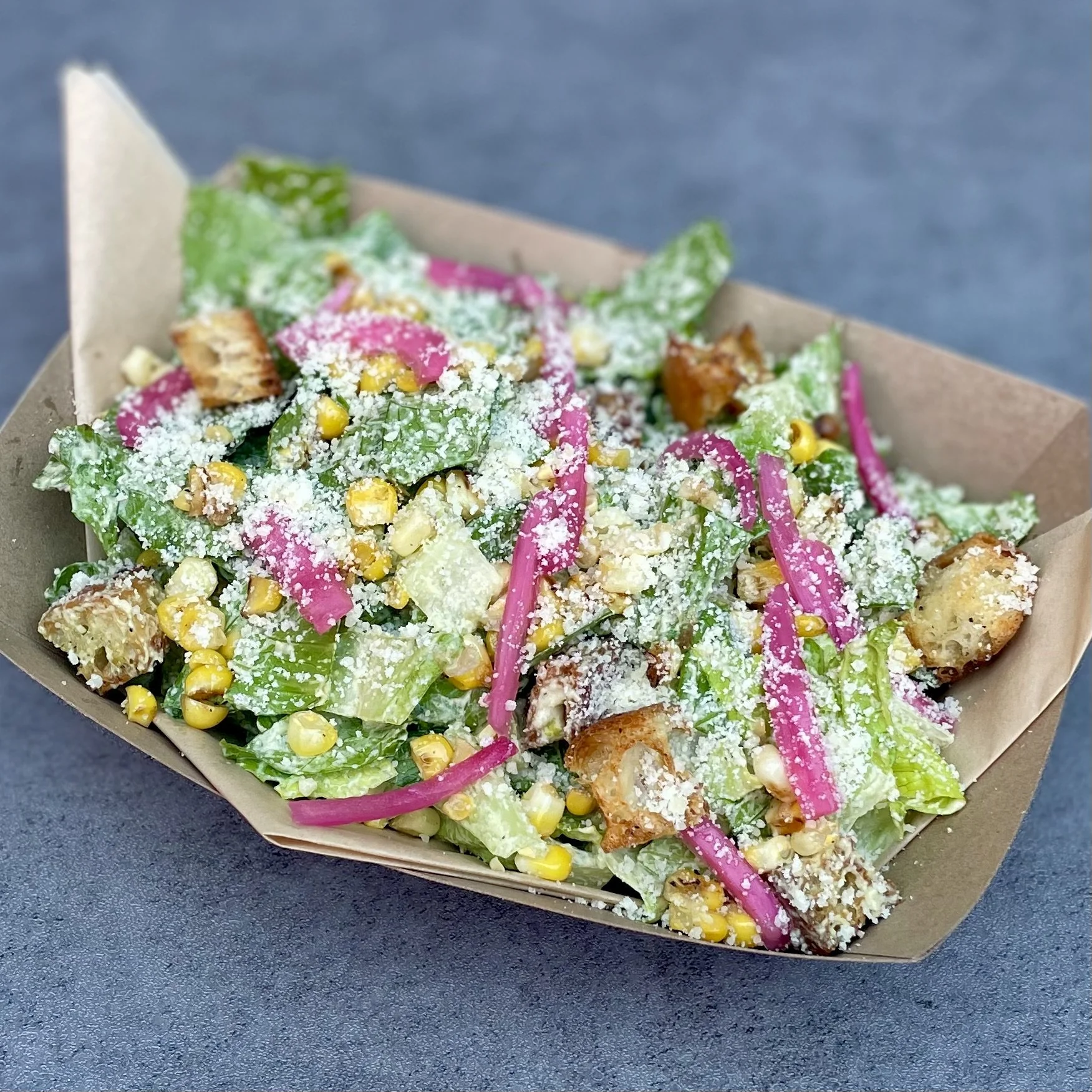 sungrounded farm romaine, roasted corn, pickled red onion, housemade croutons, parmesan, poblano almond dressing