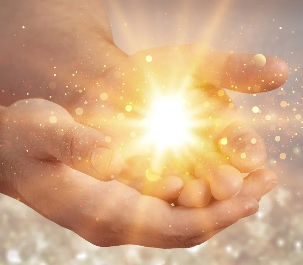 2 hands holding a bright light