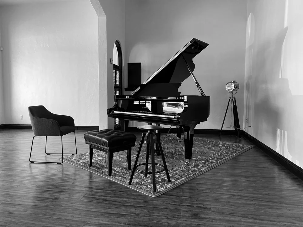 Grand piano and seating at PVT Studio