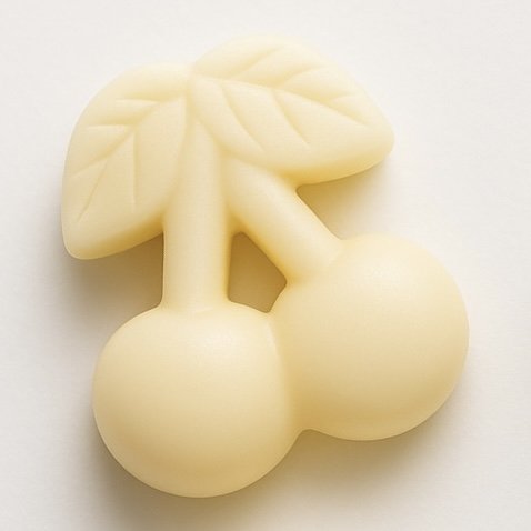 Single creamy white cherry-shaped soy wax melt with embossed leaf detail on a light background.