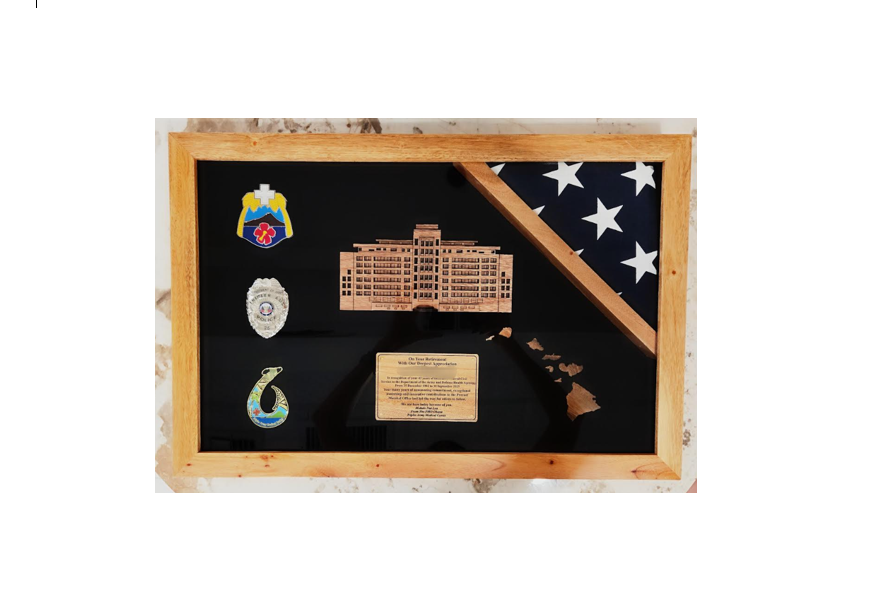 Shadow Box with a building cutout, a flag border, a logo cutout(1),  and engraving on a wood Plate