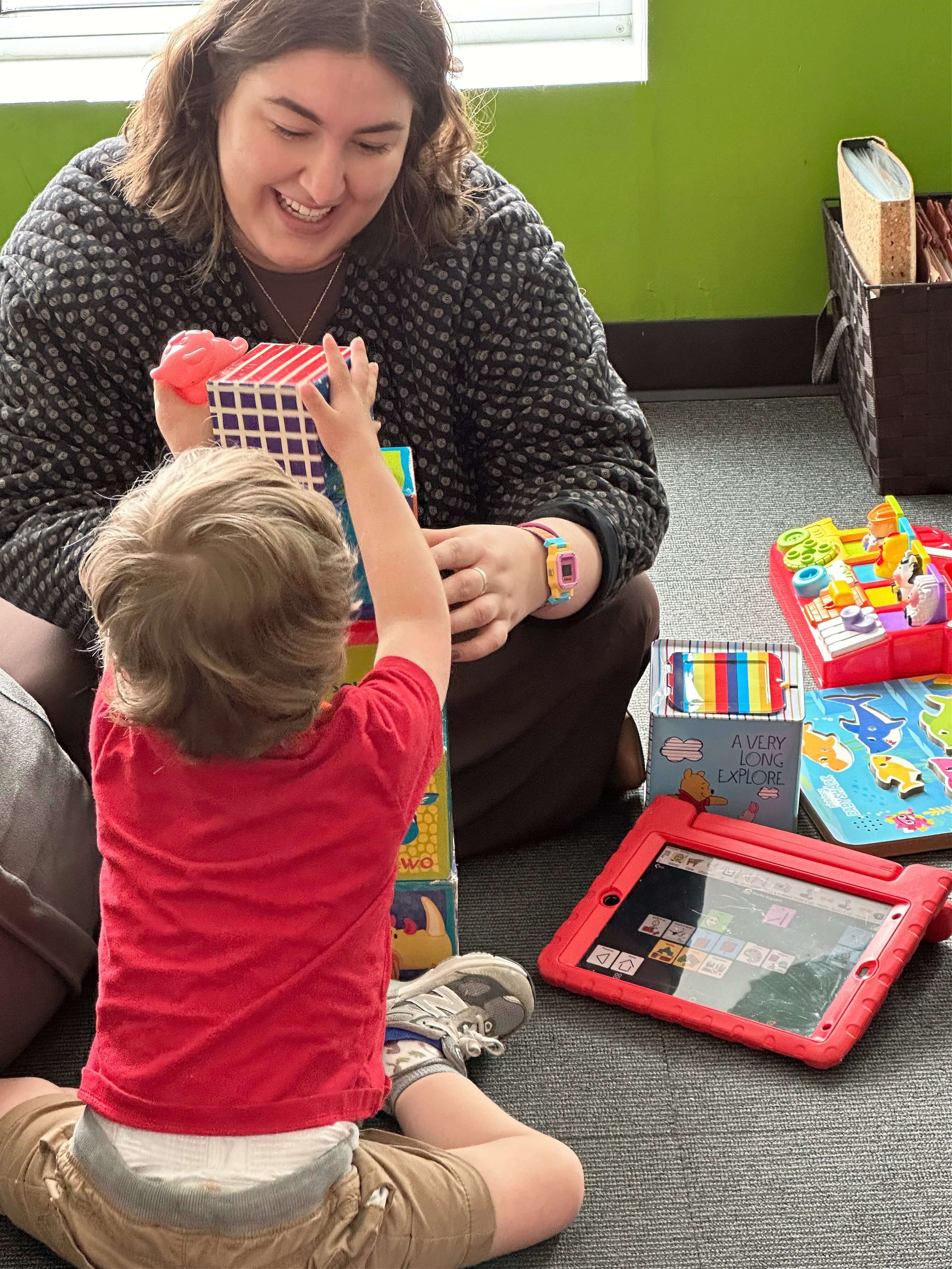 Val with young client on floor_tinified.jpeg