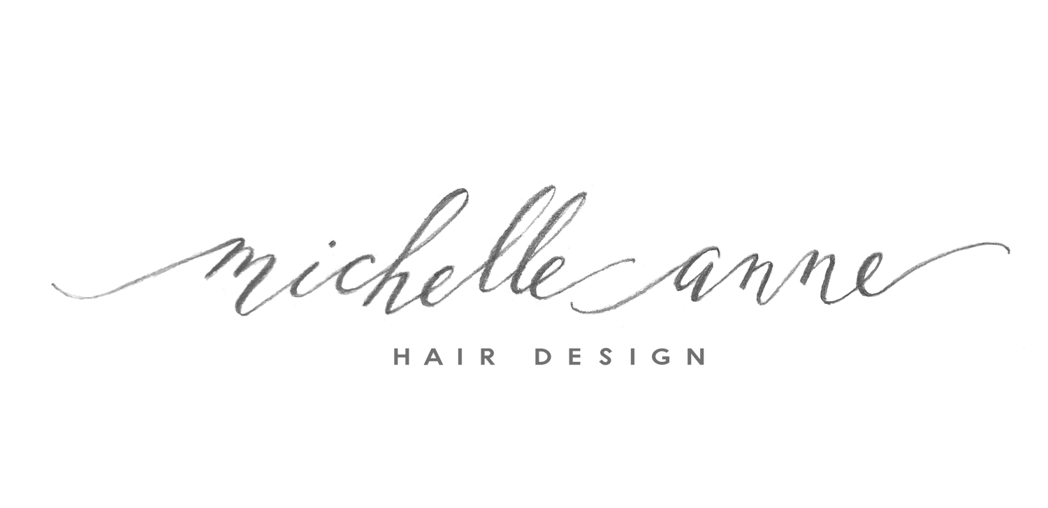 Logo for Michelle Ame Hair Design with cursive text and small uppercase text below.