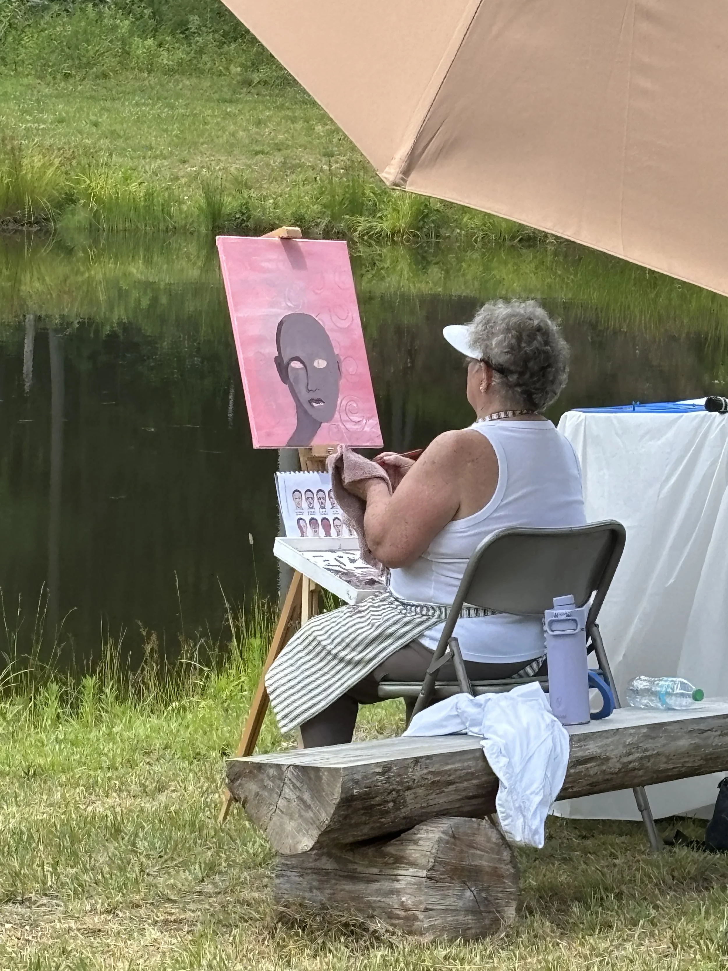 Kathy painting her face.jpg